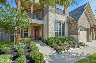 Gorgeous elevation featuring brick on 4 sides with white mortar.  Diagonal door for more privacy with beautiful porch and adorable balcony!