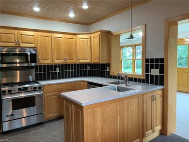 Custom designed kitchen and maple cabinetry