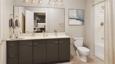 Full bathroom featuring toilet, vanity, shower / b
