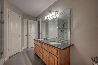 Double sinks and granite c/tops in primary bathroo