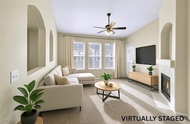 Living area with baseboards, light colored carpet,