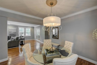 Dining area with newer light fixture.  The mirrored glass doors in background are to the Den/Office/potential 3rd bedroom.