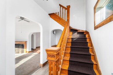 Stairway with ceiling fan, hardwood / wood-style f