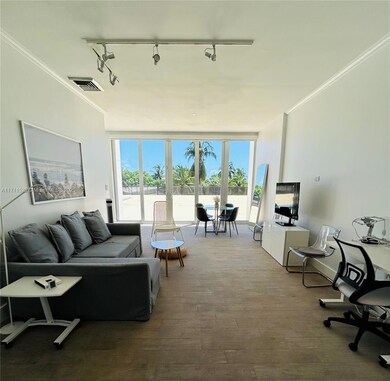 Living area: living & dining room, stand-up desk & chair