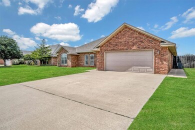 Ranch-style home featuring driveway, an attached garage, brick siding, and a shingled roof