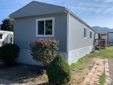 View of home's exterior and back door with a mountain view.