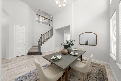 Dining room featuring a notable chandelier, stair