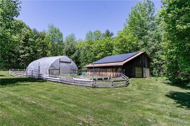 Drive-thru barn with bank of solar...