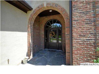Covered entry way with flagstone porch