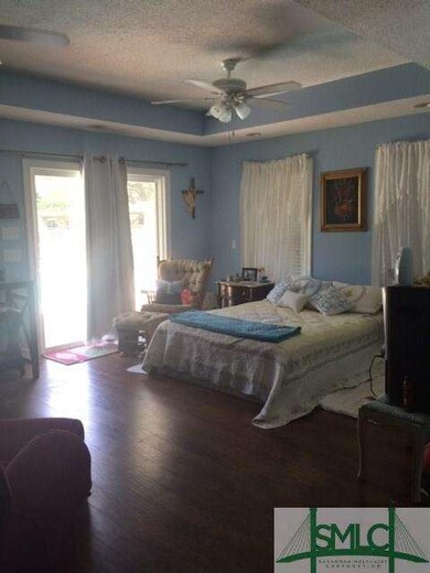 Huge master baster bedroom with sitting area, exit