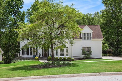 View of front of home featuring a shingled roof, s