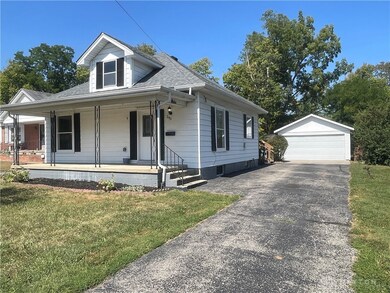 Long driveway to 2 car detached garage
