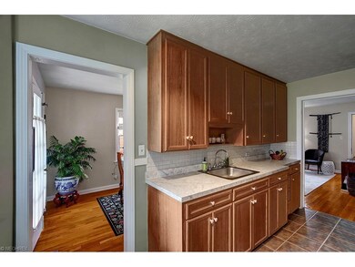 The kitchen has cabinets up to the ceiling to maxi