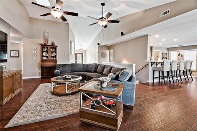 Living room open to dining room and kitchen area.