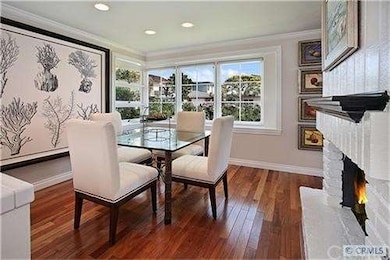 Charming dining room with fireplace and bay window