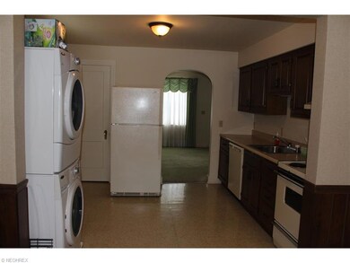 Another view of the kitchen. There is a laundry ho