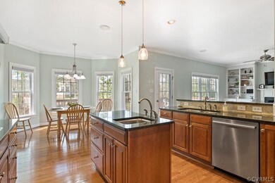 Kitchen features granite counters and Bosch applia