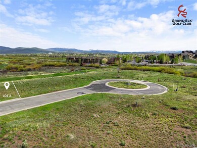 Prime golf-course exposure from Lot 2 with rolling fairways and mountain vistas defining the backdrop. Lot lines shown are approximate.