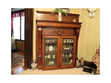 Living Room. Beautiful built-in storage with leade