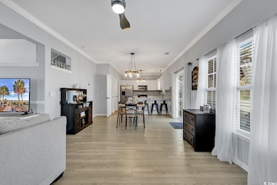 Dining space with baseboards, light wood-style flo