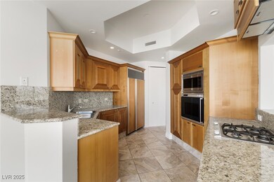 Kitchen with stainless steel appliances, a sink, a