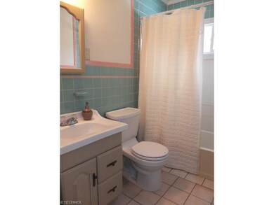 Full bath with tile floor.