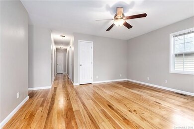 Bright Living Room with Coat Closet Ready to Entertain