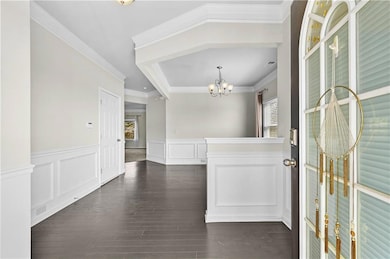 Foyer with a chandelier, a wealth of natural light