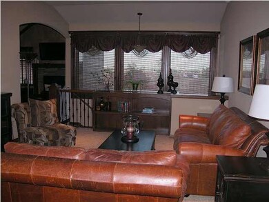 The spacious living room greets your guests. There