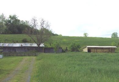   The larger building to the left is approx 25'x100' is on concrete and has power.