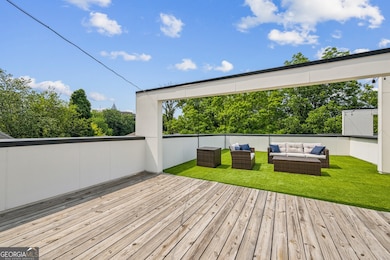 Private Rooftop Oasis is an entertainer's dream complete with Skyline Views, Multiple Lounge Areas, Turf Lawn, and plenty of space for Outdoor Dining, Grilling, or even a future Hot Tub or Expansion.