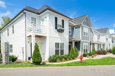 This detached home is located on the end of a row,