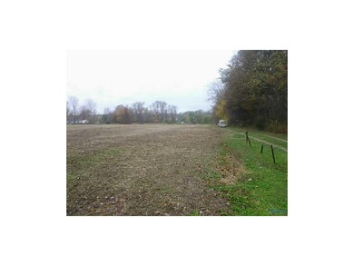 Exterior Front. Tree line on property.