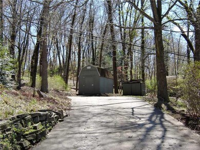 Other. Cement driveway lead to level parking area 