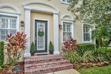 FRONT VIEW OF HOME WITH BRICK PAVER ENTRY.