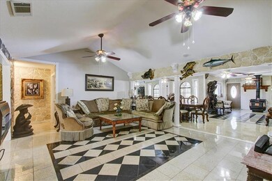 Granite floors and high ceilings in living room ov
