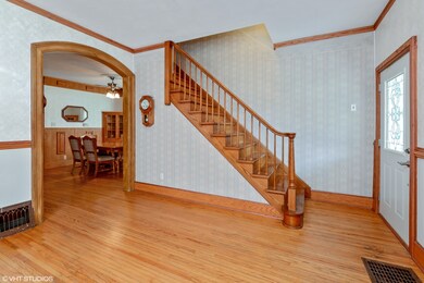 Beautiful half-open staircase and arched doorway!