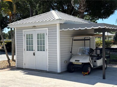 View of outdoor structure with an outbuilding and concrete driveway