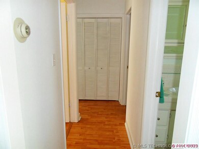 The hallway has wood laminate flooring and a great