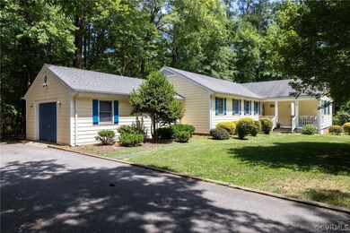 Ranch-style home with covered porch, a garage, and