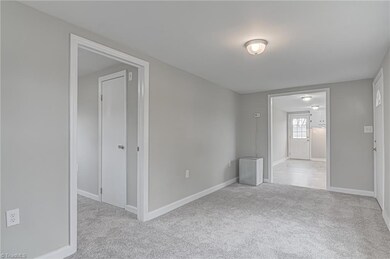Living room opens up to bedrooms and kitchen.