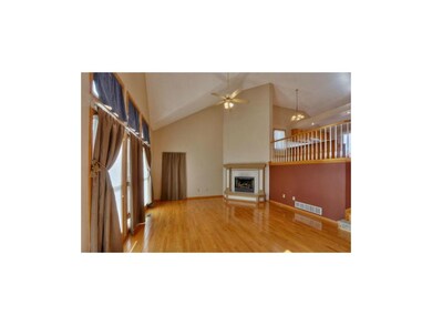 Living Room with Fireplace and Vaulted Ceiling.