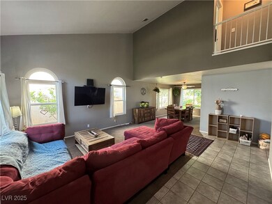 Tiled entry way leading into living room featuring