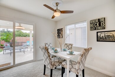 Dining room overlooks view of back patio through t