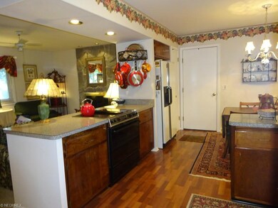 Kitchen:  Opens up to the family room