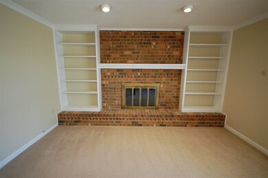 Check out the captivating fireplace, built-in shel