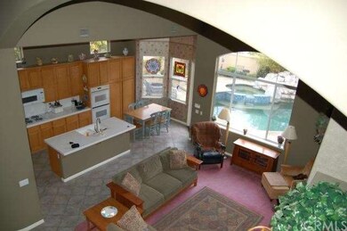 Large open family room & kitchen viewed from stair