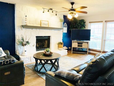 This painted rock fireplace is the star in this pl
