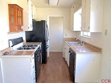 Compact, efficient kitchen - refrigerator not incl