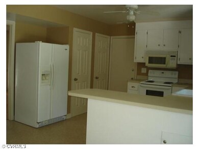 Kitchen - Kitchen with pantry and door to garage.